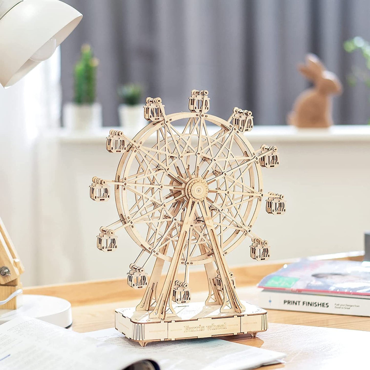 Hand-assembled wooden Ferris wheel puzzle toy for children and adults.